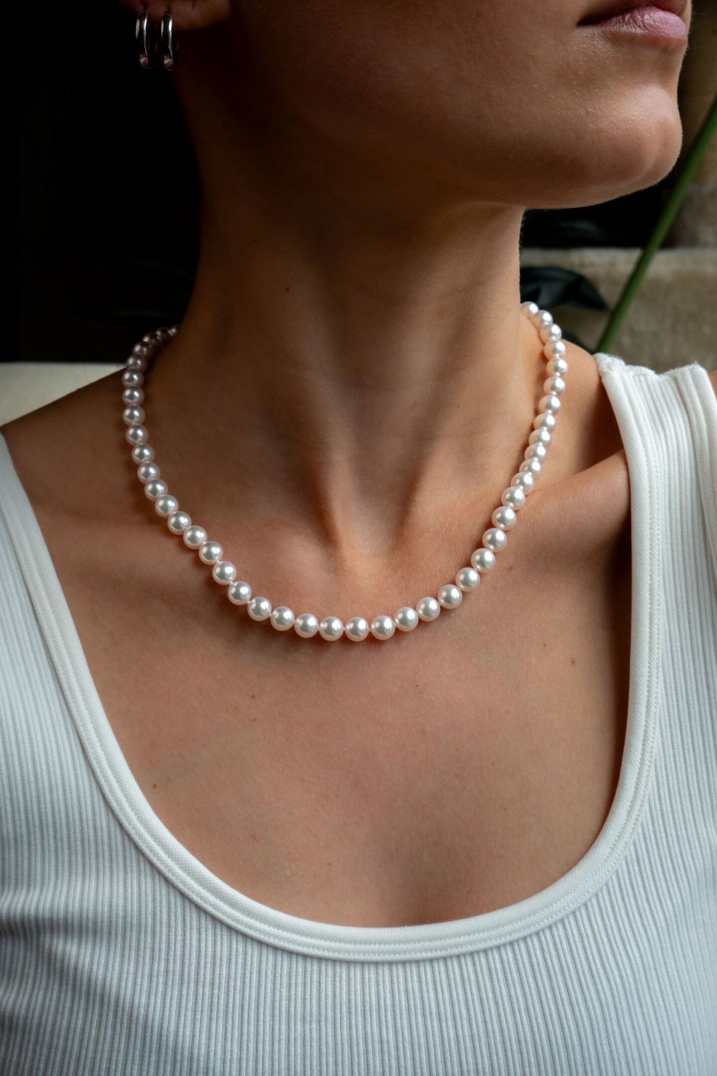 Woman wearing Akoya pearl necklace